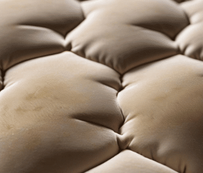 John K mattress with brown stains prior to professional mattress cleaning